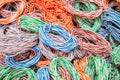 Random weaving of colored wire. Abstract colorful background of electrical cables. Multicolored wires entangled in many hanks