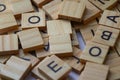 Random wooden letter stacks, wooden letter scrable toys, arrange wooden letters into words Royalty Free Stock Photo