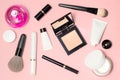 Concept of a white and black cosmetic supplies. Top view on pink background