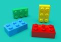 Randomly stacked toy bricks in various colors on blue background. 3d rendering minimal concept Royalty Free Stock Photo