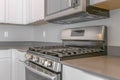 Range with cooktop and oven inside the modern kitchen of a new house Royalty Free Stock Photo