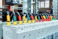 Range of electrical wires or cables are connected to the power circuit breakers. Royalty Free Stock Photo