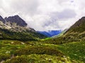 Range of mountains under angry clouds