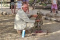 Ranger feeding wild cheetah, Namibia