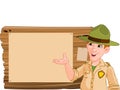 Ranger pointing at a wooden sign