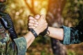 Rangers celebrating success, clapping with hands. Team work conceptual image. Soldier shaking hands . People and military concept Royalty Free Stock Photo