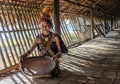 Rangus tribal Woman in her traditional tribal costume working in her house in Kudat, Malaysia