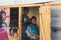 Ranohira, Madagascar - April 29, 2019: Unknown local boy getting his haircut from a friend at shop back room made from wooden