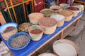 Ranohira, Madagascar - May 05, 2019: Baskets with various dried seeds, beans and fish displayed on local street market