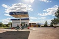 Ranohira, Madagascar - May 05, 2019: Typical gas station blue Jovenna brand at Madagascar on sunny day. Empty concrete parking