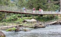 Instable old wooden bridge over a river, roadway for the local people on Ranomafana, Royalty Free Stock Photo