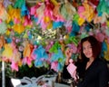 Asian women wear A black t-shirt with short hair have a smile looked at the camera pose With hand-holding rainy doll