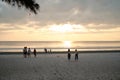 People are visiting at tropical paradise beach on Aow Yai Beach during sunset time in Ko Phayam island.