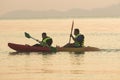 RANONG THAILAND - MARCH 20 : thai tourist sailing sea kayak against beautiful morning lingt at payam island on march 20, 2016 in Royalty Free Stock Photo