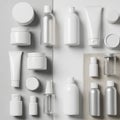 Ranslucent and opaque bottles, jars, and tubes in white and silver Royalty Free Stock Photo