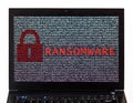 Ransomware text with red lock over encrypted text on a laptop sc