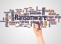 Ransomware word cloud and hand with marker concept Royalty Free Stock Photo