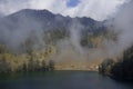 Ranu Kumbolo camp site, Indonesia, August 2019. Panoramic view of beautiful mountain lake, concept of resting place Royalty Free Stock Photo