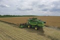 Rape harvest using combine harvester on summer field. Mechanical harvesting of oilseed rape Brassica napus. production of plant