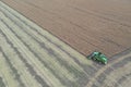 Rape harvest using combine harvester on summer field. Mechanical harvesting of oilseed rape Brassica napus.