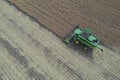 Rape harvest using combine harvester on summer field. Mechanical harvesting of oilseed rape Brassica napus.