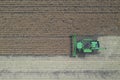 Rape harvest using combine harvester on summer field. Mechanical harvesting of oilseed rape Brassica napus.