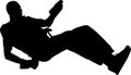 Silhouette of a man rappelling.