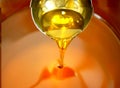 Rapeseed canola oil organic quality bio, bubbles active, mixing and pouring in a steel barrel, for cold food and fried