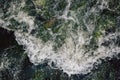 The rapid flow of water with white waves and air bubbles. Top view of a stream of fast flowing water Royalty Free Stock Photo