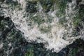 The rapid flow of water with white waves and air bubbles. Top view of a stream of fast flowing water Royalty Free Stock Photo