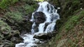 Rapid mountain stream and waterfall