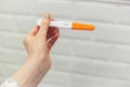 Rapid pregnancy test with negative result in woman`s hand. Human chorionic gonadotropin test