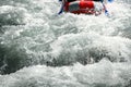 Rapid rapids of a mountain river with rafting tourists in an inflatable raft with copy space Royalty Free Stock Photo