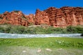 Rapid river and strange red rock formations