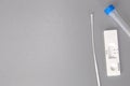 Rapid self test Covid-19 with nose swab, home test kit for coronavirus top view on gray background with copy space