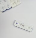 Rapid test cassette for CEA (carcinoembryonic antigen) test showing positive result, tumor marker for Colon cancer. Royalty Free Stock Photo