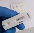 Rapid test device or cassette for Rubella (German measles) test showing positive result.