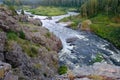 Rapids on the river rapidly running among the woods and stones Royalty Free Stock Photo