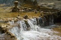 Rapids and waterfalls on the fast mountain river. Close-up of fast flowing water and stones. Olkhovka river in Kislovodsk Royalty Free Stock Photo