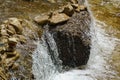 Rapids and waterfalls on the fast mountain river. Close-up of fast flowing water and stones. Olkhovka river in Kislovodsk Royalty Free Stock Photo