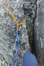 Rappel stance made of loop and cord on a boulder in the mountains. Climber prepared to rappel down Royalty Free Stock Photo