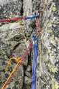 Rappel stance, safety loop and rappel rope while preparing for rappelling from the rappel anchor after finishing climbing in the