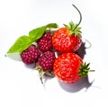 Rapsberry and strawberry on whitte plate Royalty Free Stock Photo