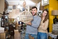 Raptured guy and surprised girl wth hanging lamp Royalty Free Stock Photo