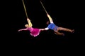 Rapunzel and Flynn fly in air during Disney on Ice