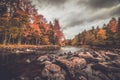 Raquette River surrounded by brilliant fall foliage in Long Lake NY, ADK Mountains Royalty Free Stock Photo