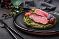 Rare ahi tuna steak slices with fresh herbs Royalty Free Stock Photo
