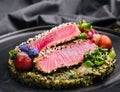 Rare ahi tuna steak slices with fresh herbs Royalty Free Stock Photo