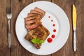 Rare Beef steak medium grilled with barbecue sauce. Wooden table. Top view. Close-up Royalty Free Stock Photo