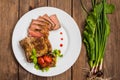 Rare Beef steak medium grilled with barbecue sauce. Wooden table. Top view. Close-up Royalty Free Stock Photo